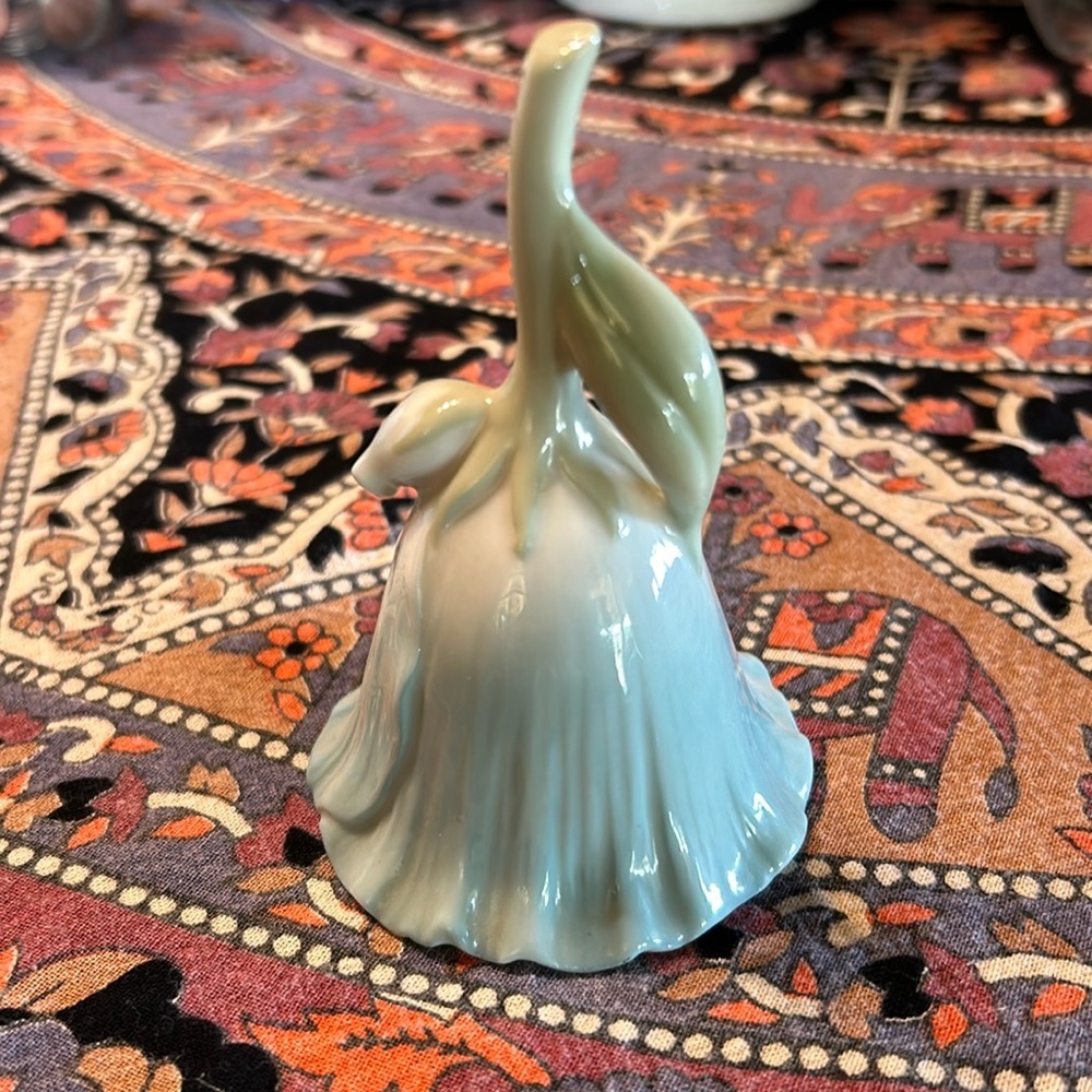 Porcelain flower shaped bell.  Misty light blue and sage green. Collector item